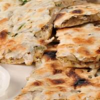 Onion Kulcha · Stuffed with onion traditional hand tossed bread freshly baked in a tandoor (clay oven)