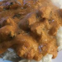 Chicken Josh · Tender boneless chicken cooked in a yogurt based curry sauce blended with indian spices.