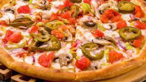 Mexican Pizza (Medium) · Refried beans, mozzarella cheese, cheddar cheese, red onion, corn, sausage, & garnish: sour cream & cilantro.