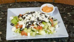 Greek Salad · Romaine lettuce, tomato, onion, black olives, banana peppers, feta cheese, Greek sauce, gyro...