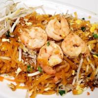 Pad Thai · Stir-fried rice noodles with your choice of meat, egg, bean sprouts, green onions, crushed p...