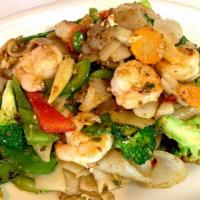 Drunken Noodles · Stir-fried fresh wide rice noodles, your choice of meat, carrot, tomato, onion, bell pepper,...