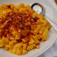 Classic Mac N Cheese · Spiral macaroni, cheddar cheese and cream. Baked with smoked gouda and cheddar. Sprinkled wi...