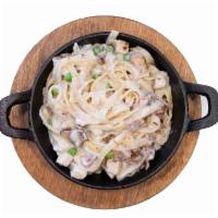 Country Alfredo · Penne noodles with Alfredo Sauce, chicken, bacon, mushrooms and sweet peas.