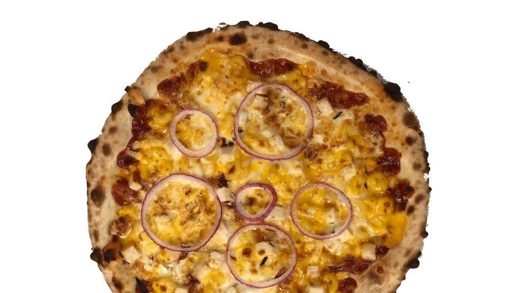 Bbq Chicken Mac Pizza · A barbecue sauce base with provolone and mozzarella cheese, elbow mac n’ cheese, chicken, red onions and a sprinkle of smoked gouda cheese.