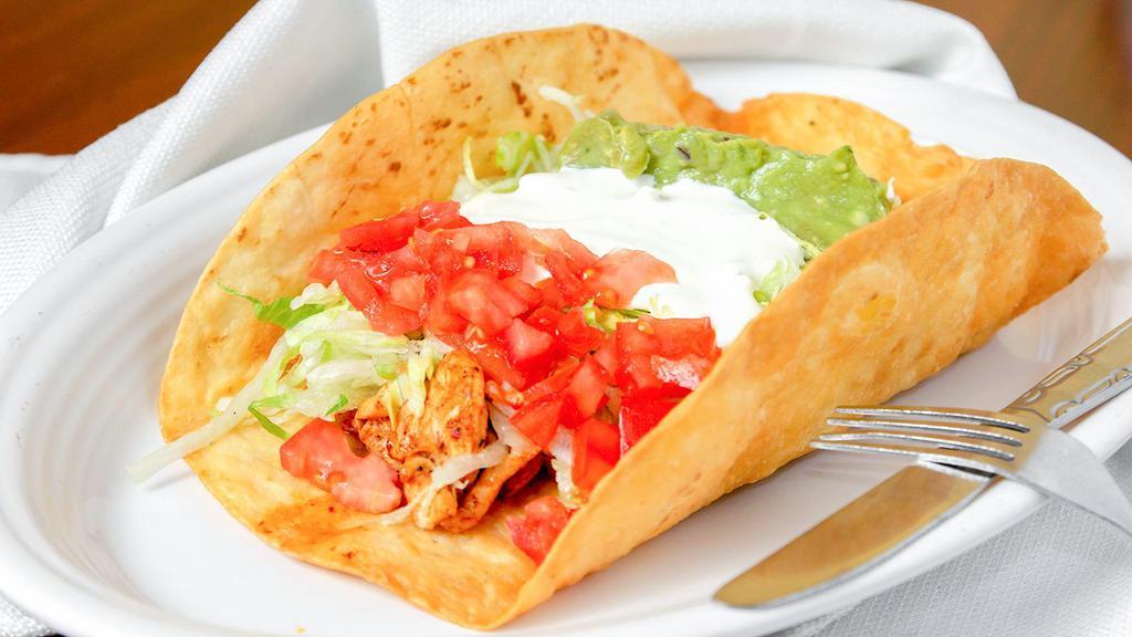 #49. Taco Loco Salad · A crispy fried flour shell with grilled chicken or steak, lettuce, cheese, tomatoes, sour cream and guacamole.