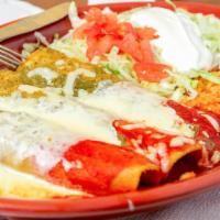 #80. Enchiladas Mi Bandera · Three enchiladas, one beef, one chicken and one cheese cover with cheese, green and ranchera...