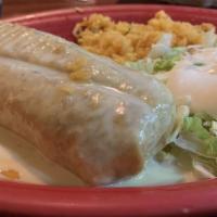 #59. Seafood Chimichanga · Flour tortilla filled with tilapia, shrimp, scallops and crab meat topped with cheese sauce....