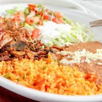 #35. Carnitas · Fried pork tips, rice, beans, lettuce, guacamole, pico de gallo and tortillas.