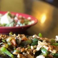 Chicken Fajitas · Grilled Chicken grilled with bell peppers, tomatoes, and onions. Served with rice, beans, gu...