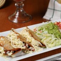 Fried Tacos · Three deep fried tacos filled with ground beef, jalapenos, tomatoes, and onions.  Served wit...