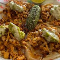 Chori-Pollo Tacos · Four soft shell grilled chicken tacos topped with onion, chorizo, white cheese dip, guacamol...