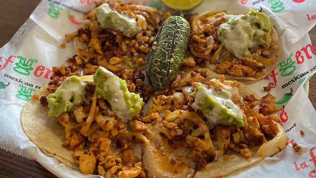 Chori-Pollo Tacos · Four soft shell grilled chicken tacos topped with onion, chorizo, white cheese dip, guacamole, and a deep fried jalapeño pepper. Served with a side of rice.