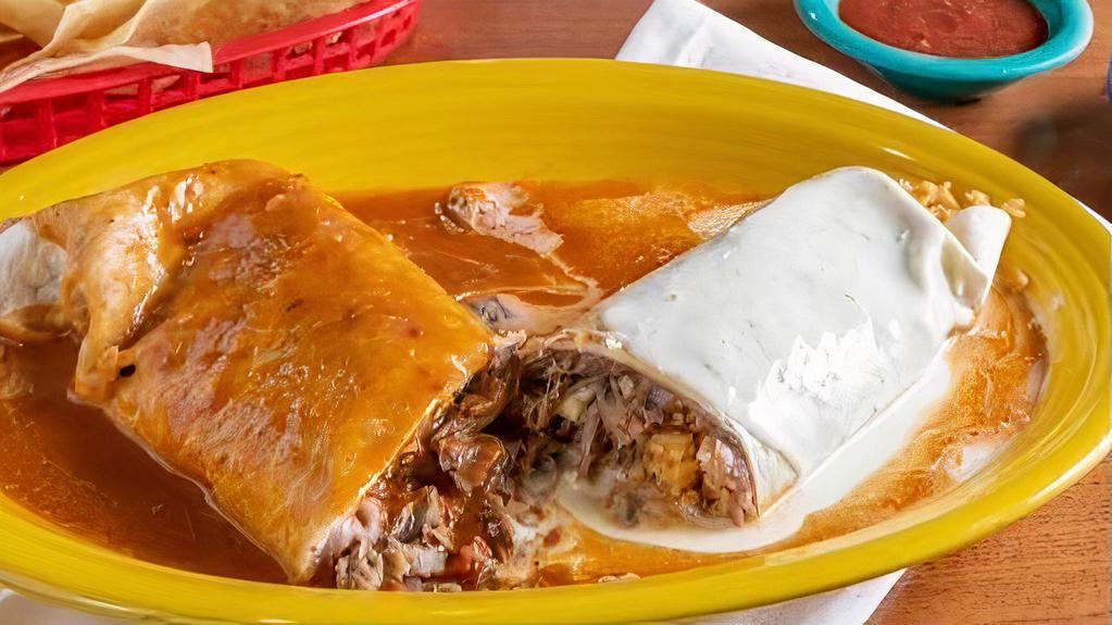 Burrito Rio Grande · A massive flour tortilla burrito stuffed with the filling of your choice, beans, and rice INSIDE. Topped with white cheese dip and red enchilada sauce.