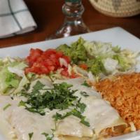 Popeye Enchiladas  · Three shredded chicken and spinach flour tortilla enchiladas, topped with spinach & white ch...