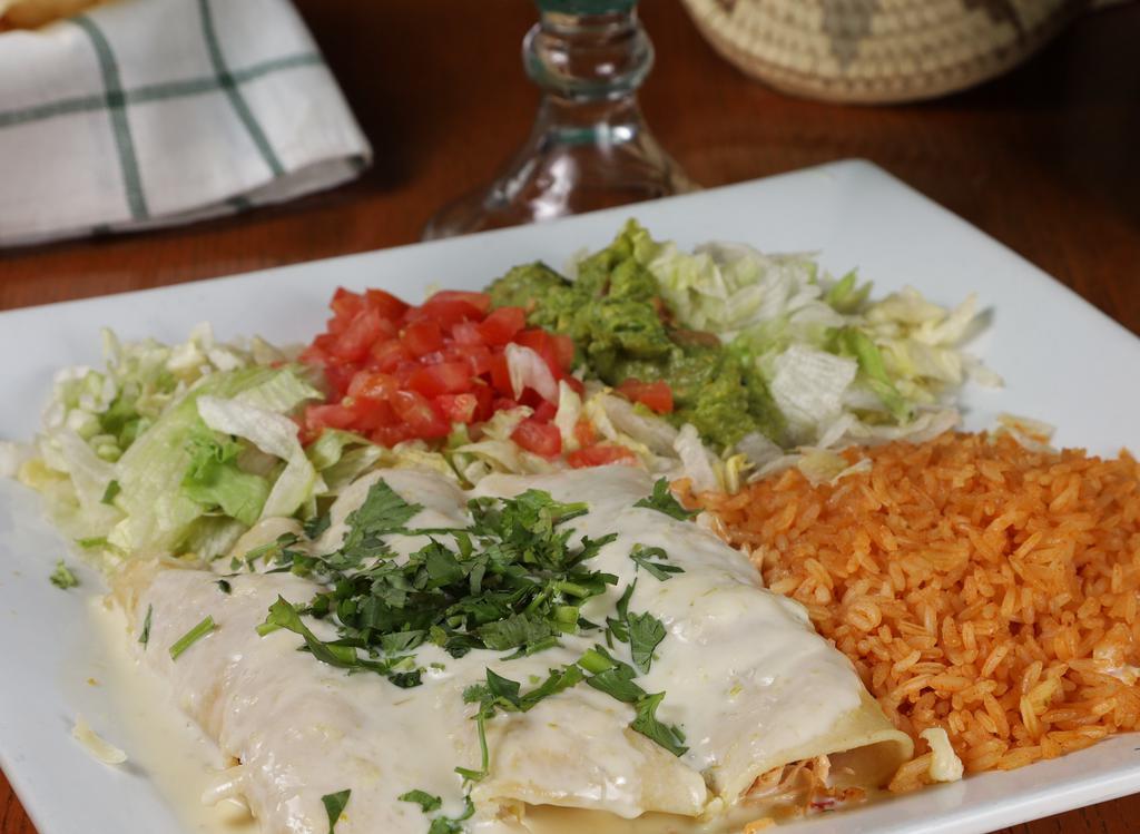 Popeye Enchiladas  · Three shredded chicken and spinach flour tortilla enchiladas, topped with spinach & white cheese dip. Served with lettuce, tomato, guacamole, and sour cream.