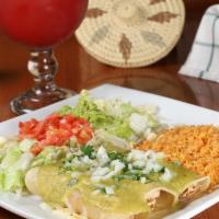 Enchiladas Verdes  · Three shredded chicken flour tortilla enchiladas, topped with green sauce, onion & cilantro....