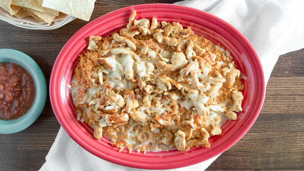 Pollo Cheese Dip · Grilled Chicken over a bed of rice, topped w/ white cheese dip.