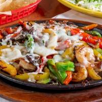 Pollo Fundido · Grilled Chicken & Shrimp grilled w/ mushrooms & peppers.  Topped w/ melted white cheese. Ser...