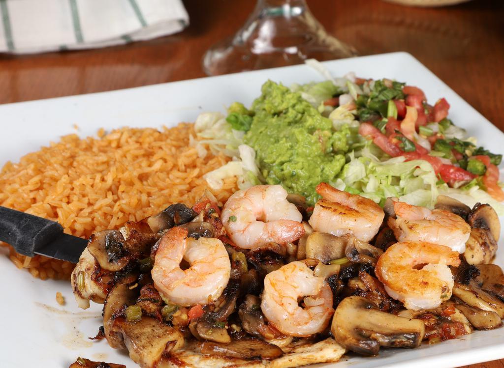 Pollo Cancun · Grilled Chicken breast & Shrimp topped w/ pico de gallo & mushrooms. Served w/ rice, guacamole, lettuce, & tortillas.