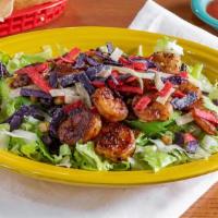 Avocado Shrimp Salad · Grilled shrimp and slices of fresh avocado over a bed of romaine lettuce with colorful torti...