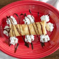 Xangos · A slightly deep fried chimichanga filled with cheesecake, strawberry syrup, and honey. Coate...