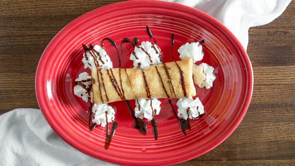 Xangos · A slightly deep fried chimichanga filled with cheesecake, strawberry syrup, and honey. Coated in cinnamon-sugar. (Made in-house)