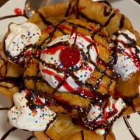 Signature Fried Ice Cream · Vanilla ice cream covered in frosted flakes & slightly deep fried. Served in a crispy tortil...