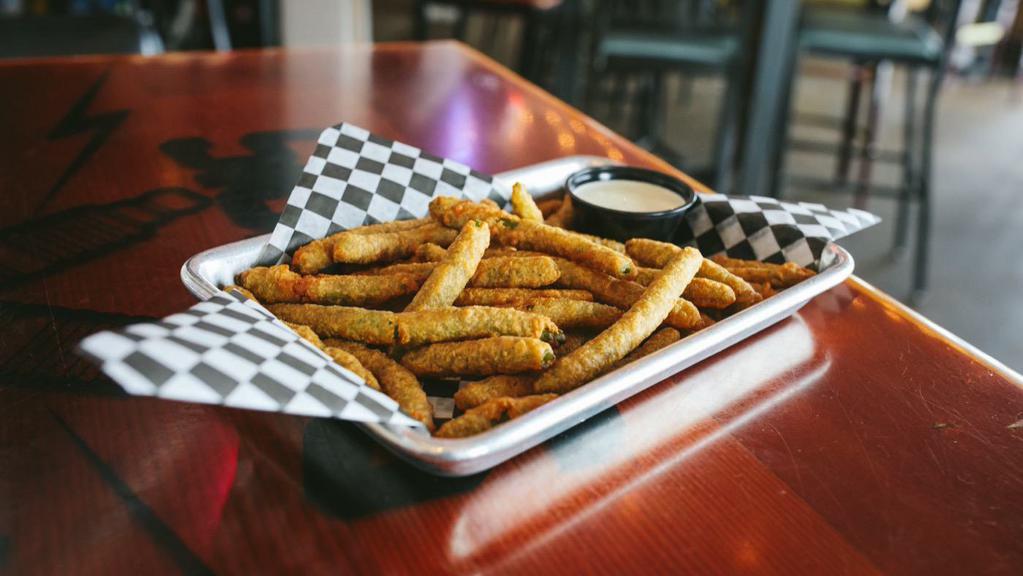 Fried Green Beans · Lightly breaded and fried green beans served with our very own avocado ranch dressing.