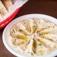 Feta Hummus · Vegetarian. Hummus topped with crumbled feta and olive oil. Served with grilled pita.