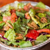 Fattoush Salad · Vegan. Chopped lettuce, tomato, cucumber, pita chips, green and red pepper, sumac, mixed wit...