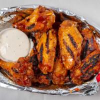 Grilled Wings · We take wings to another level. Our jumbo wings are fried to perfection and then tossed on t...