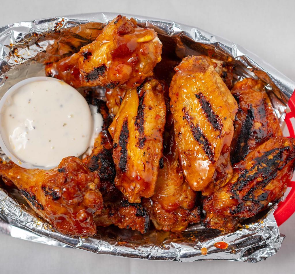 Grilled Wings · We take wings to another level. Our jumbo wings are fried to perfection and then tossed on the grill to add that little crisp and flavor our mouth will thank you for. buffalo, sweet red chili, garlic parmesan, BBQ.