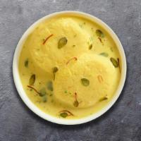 Sweet Rasmalai · Soft cottage cheese balls served in chilled creamy milk.