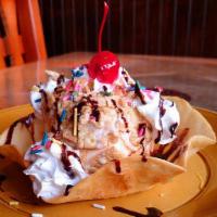 Fried Ice Cream · A Classic! A giant scoop of vanilla ice cream topped with sizzling caramel syrup, sprinkles,...