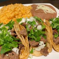 Taco Dinner · Three tacos with rice and beans