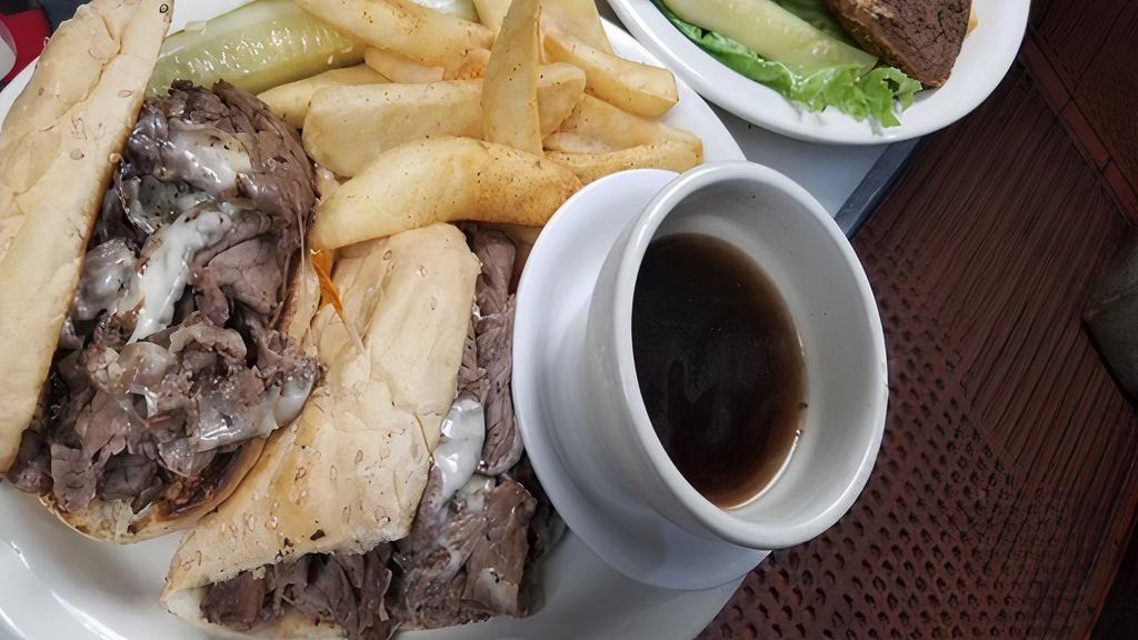 French Dip Sandwich · Thin sliced roast beef with melted provolone on a toasted bun with au jus.