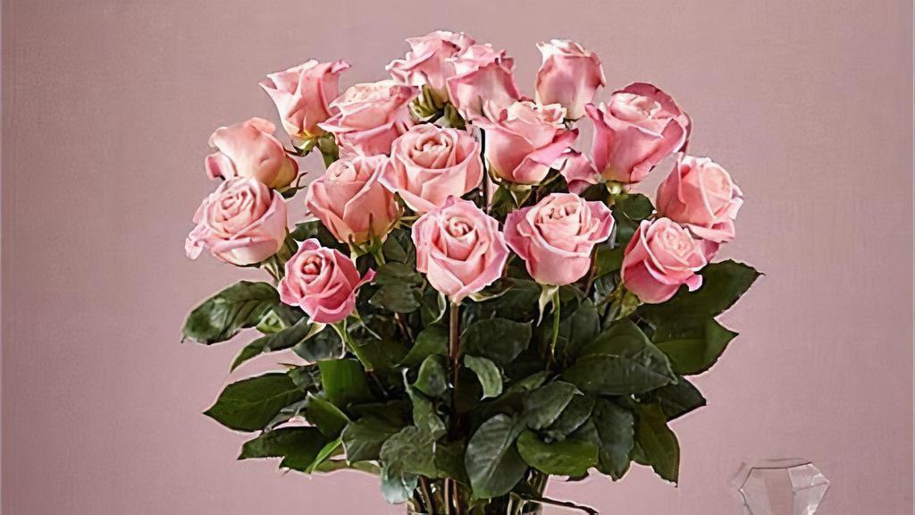 24 Long Stem Pink Roses · Enjoy the classic beauty of the rose with a playful twist in our Long Stem Pink Rose Bouquet. This arrangement features 24 pink roses that will look especially pretty in the hands of those you cherish most. Vase included. Item # E5440P