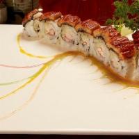Dragon Roll · Grilled eel over lobster meat, blue crabmeat & cucumber roll