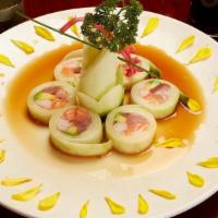 Naruto Roll · Cucumber wrapped over salmon, tuna, yellowtail, crabstick, avocado & masago