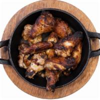 Wood Fired Wings · Oven baked chicken wings.