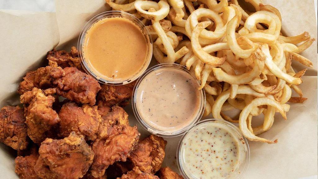 24 Piece Nuggies & Curly Fries · 100% made-from-scratch. Pickle-brined nuggets served with loads of curly fries and 4 sauces. All sauces are made-from-scratch house recipes.