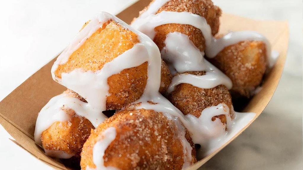 Doughnuggies · Our proprietary donuts holes tossed in cinnamon sugar and drizzled in icing.