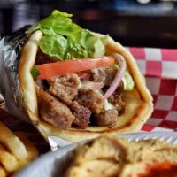 Gyro Sandwich · Topped with: romaine lettuce, tomatoes, onions, and tzatziki sauce.