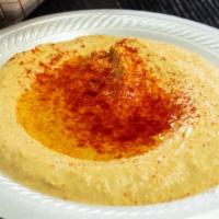Hummus & Pita · Chick peas blended with tahini, lemon juice, and garlic.