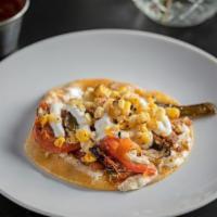 Rajas Poblanas  (2 Per Order) · Poblano peppers, cheese and corn.