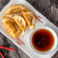 A8 Fried Chicken Dumplings (4) · Fried chicken dumplings served with special house.