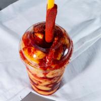Mangonada · Mango shurbert with chamoy sauce, tajin chile powder, and a squeeze of lime topped with fres...