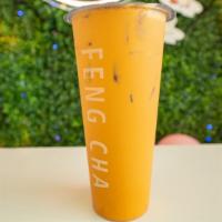 Thai Milk Tea (Iced) · Strong brewed thai tea complimented by the creaminess of our house made milk mix for a rich ...