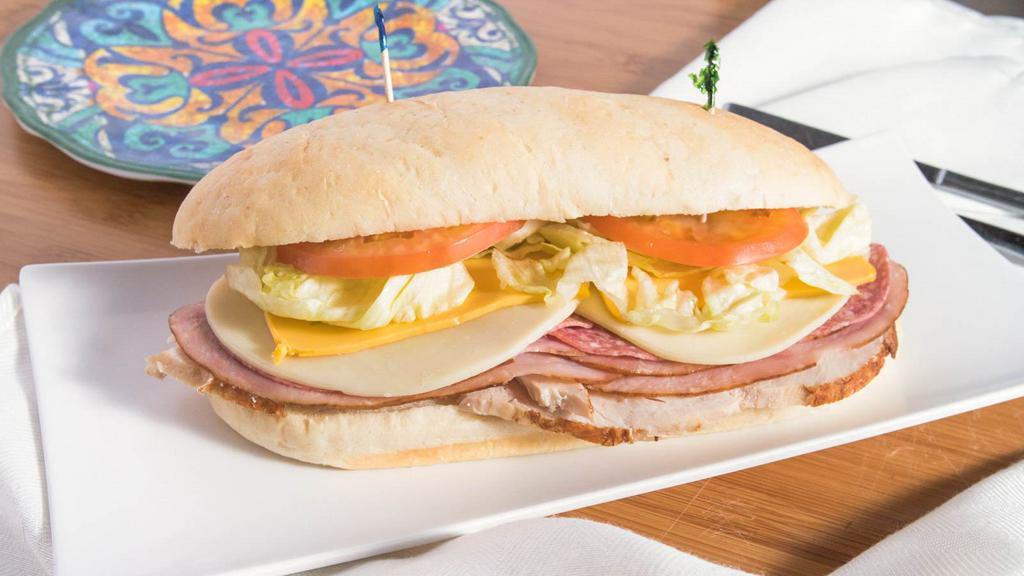 The Big Cliff Sandwich · On a hoagie bun. Ham, salami, turkey, American cheese, provolone cheese, lettuce, tomato, onion, and Italian dressing.